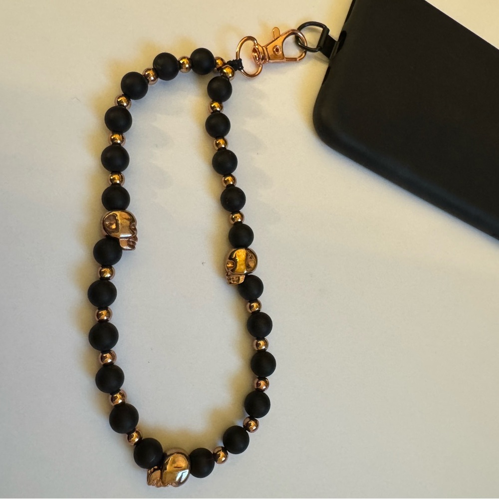 Cell phone wristlet from The Charm Hut works on any phone case